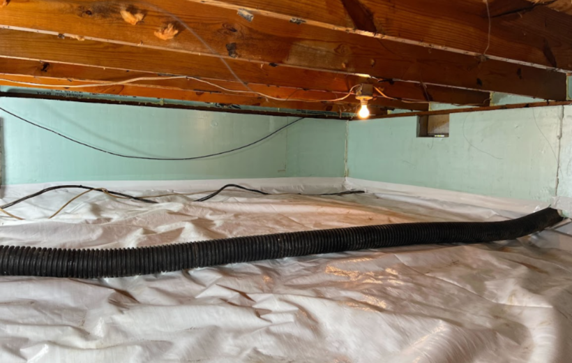 Professional crawlspace encapsulation with a vapor barrier and insulation installed