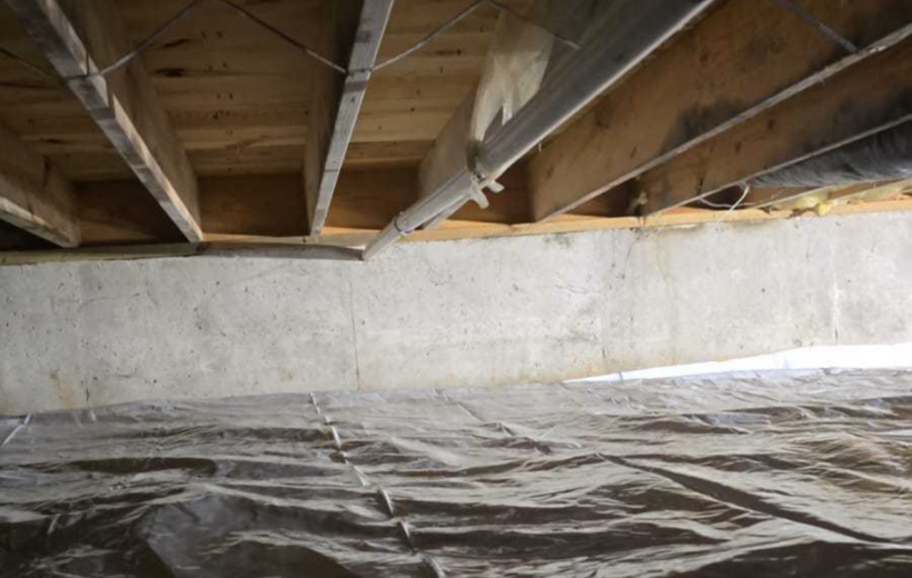 Crawl space dig out with installed floor joist support and vapor barrier